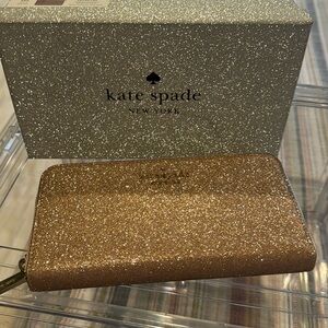Kate Spade Rose gold glitter wallet.  Excellent condition.  Used once.